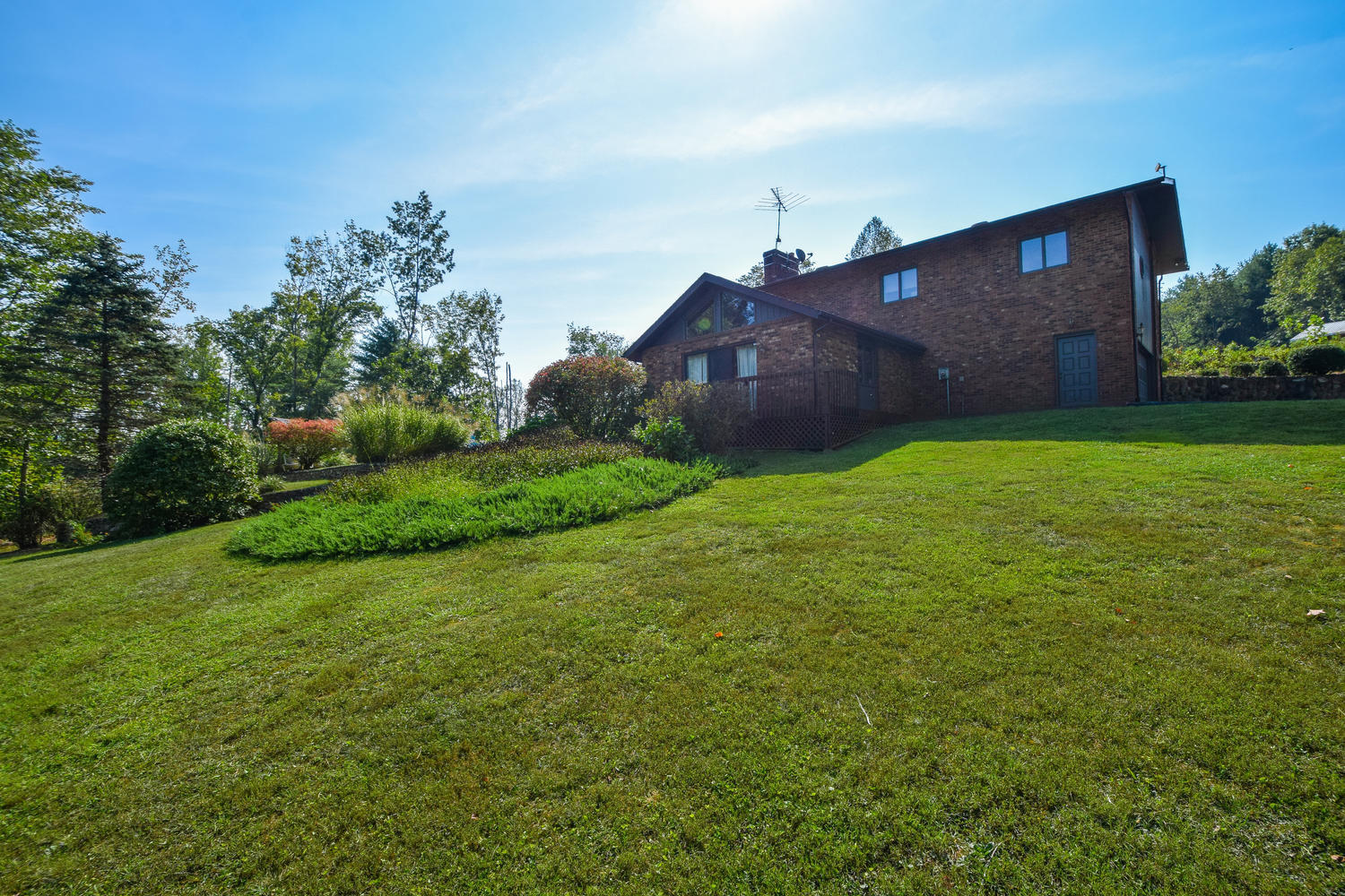 211 Rhododendron Road Callaway, VA 24067 - Photo 40 of 48 a big yard with lots of green space and plants
