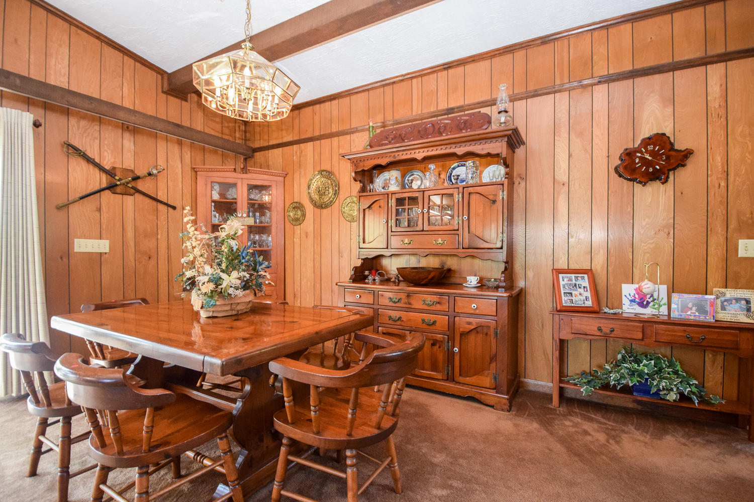 211 Rhododendron Road Callaway, VA 24067 - Photo 9 of 48 a dining room with furniture and a chandelier