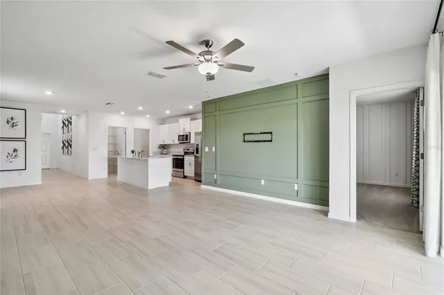 a view of a livingroom with a ceiling fan
