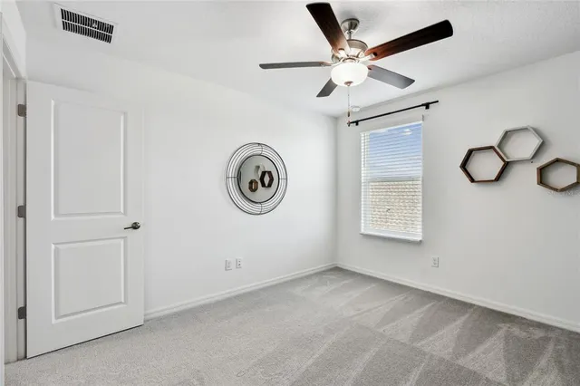 a house view with swimming pool in front of it