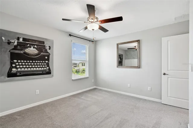 an aerial view of residential houses with outdoor space and swimming pool