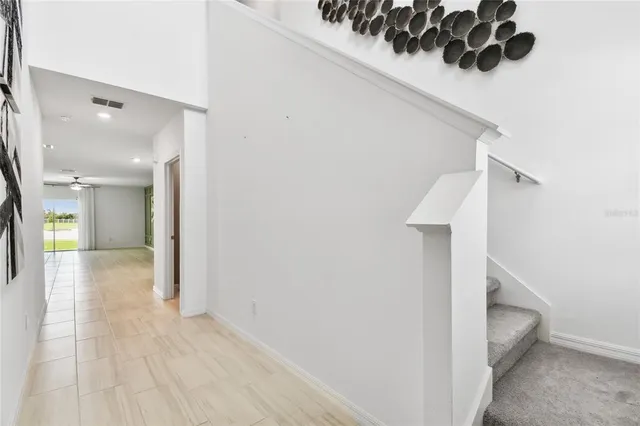 a kitchen with a refrigerator a sink a stove a microwave and cabinets