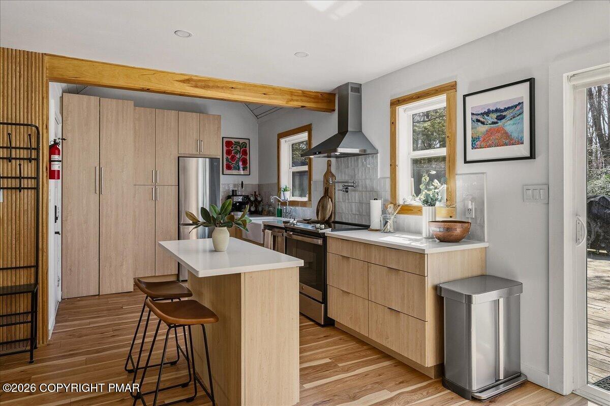 5306 Hummingbird Drive Pocono Summit, PA 18346 - Photo 12 of 32 a kitchen with a sink appliances and cabinets