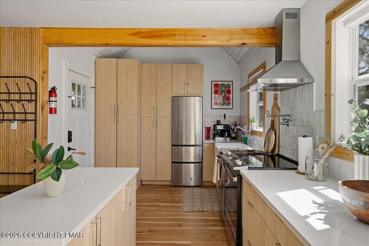 5306 Hummingbird Drive Pocono Summit, PA 18346 - Photo 13 of 32 a kitchen with stainless steel appliances granite countertop a refrigerator a stove and a sink