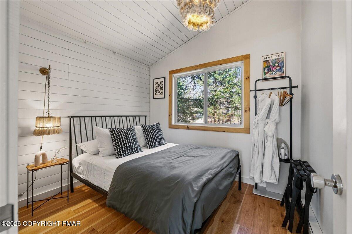 5306 Hummingbird Drive Pocono Summit, PA 18346 - Photo 16 of 32 a bed room with a bed and a window