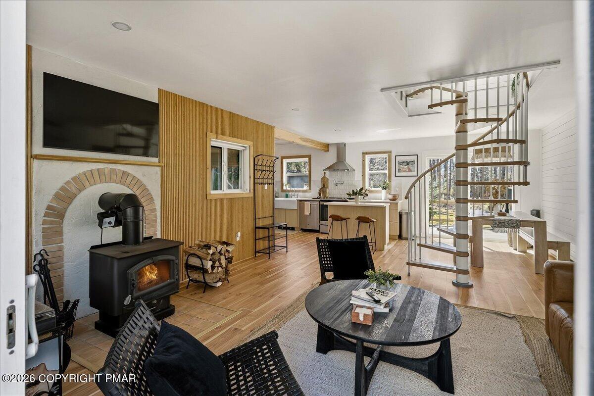 5306 Hummingbird Drive Pocono Summit, PA 18346 - Photo 2 of 32 a living room with furniture and a fireplace