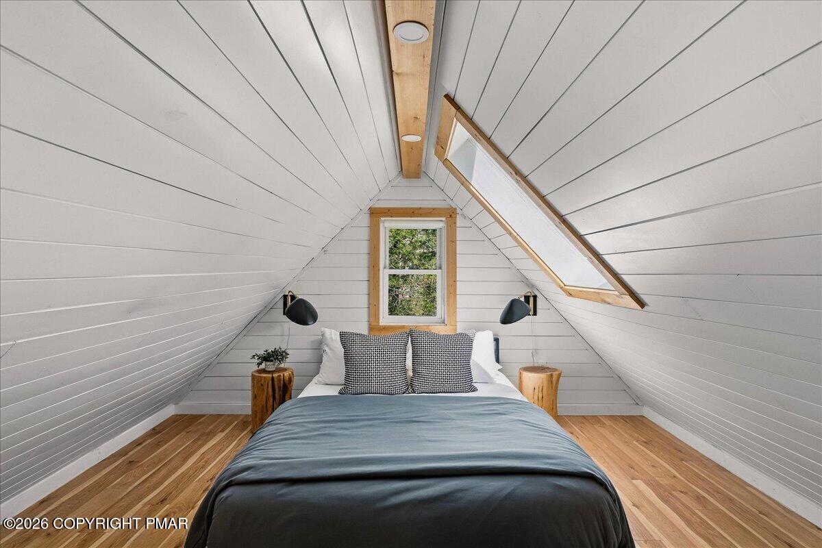 5306 Hummingbird Drive Pocono Summit, PA 18346 - Photo 22 of 32 a bedroom with bed and window