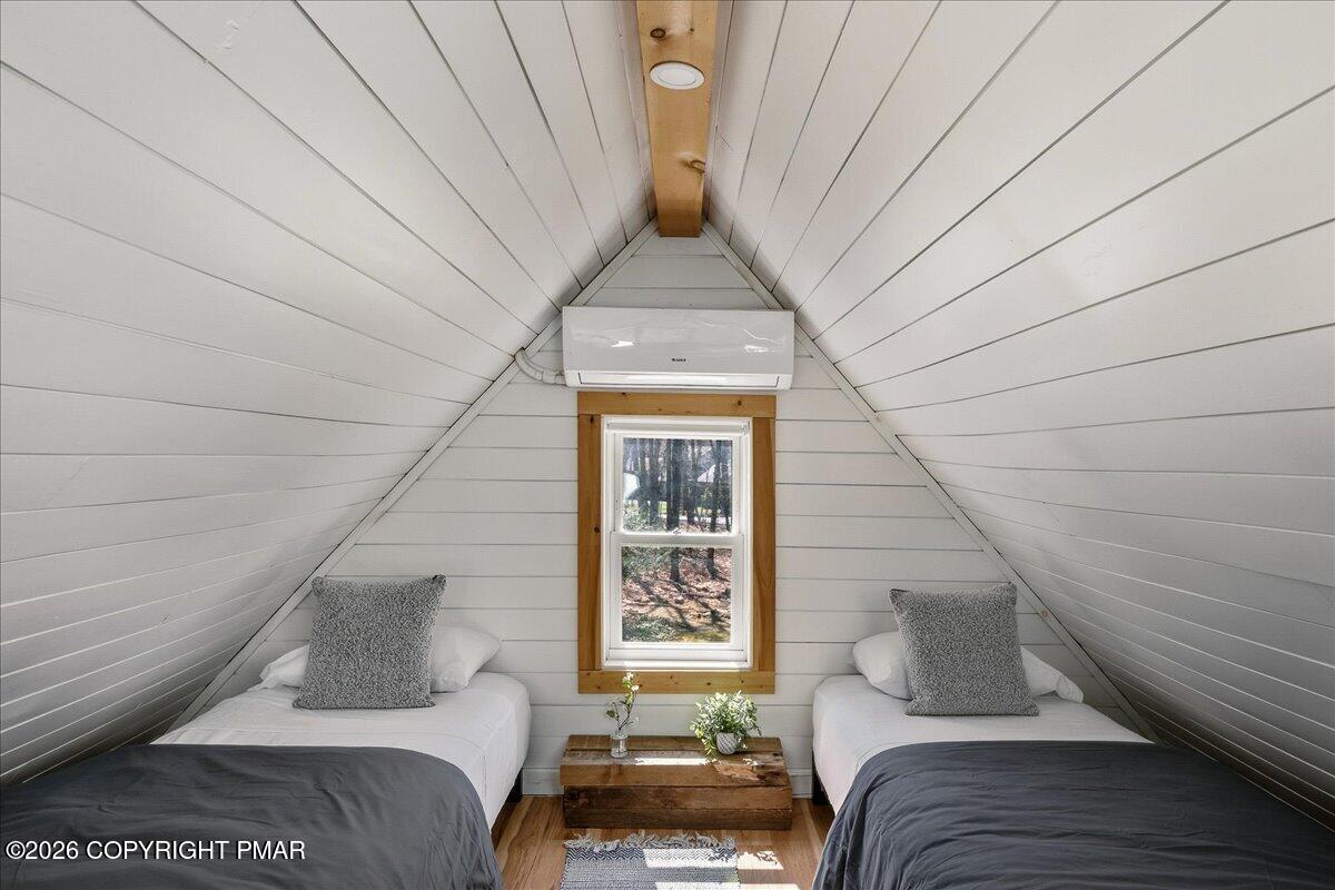 5306 Hummingbird Drive Pocono Summit, PA 18346 - Photo 24 of 32 a living room with furniture and a window