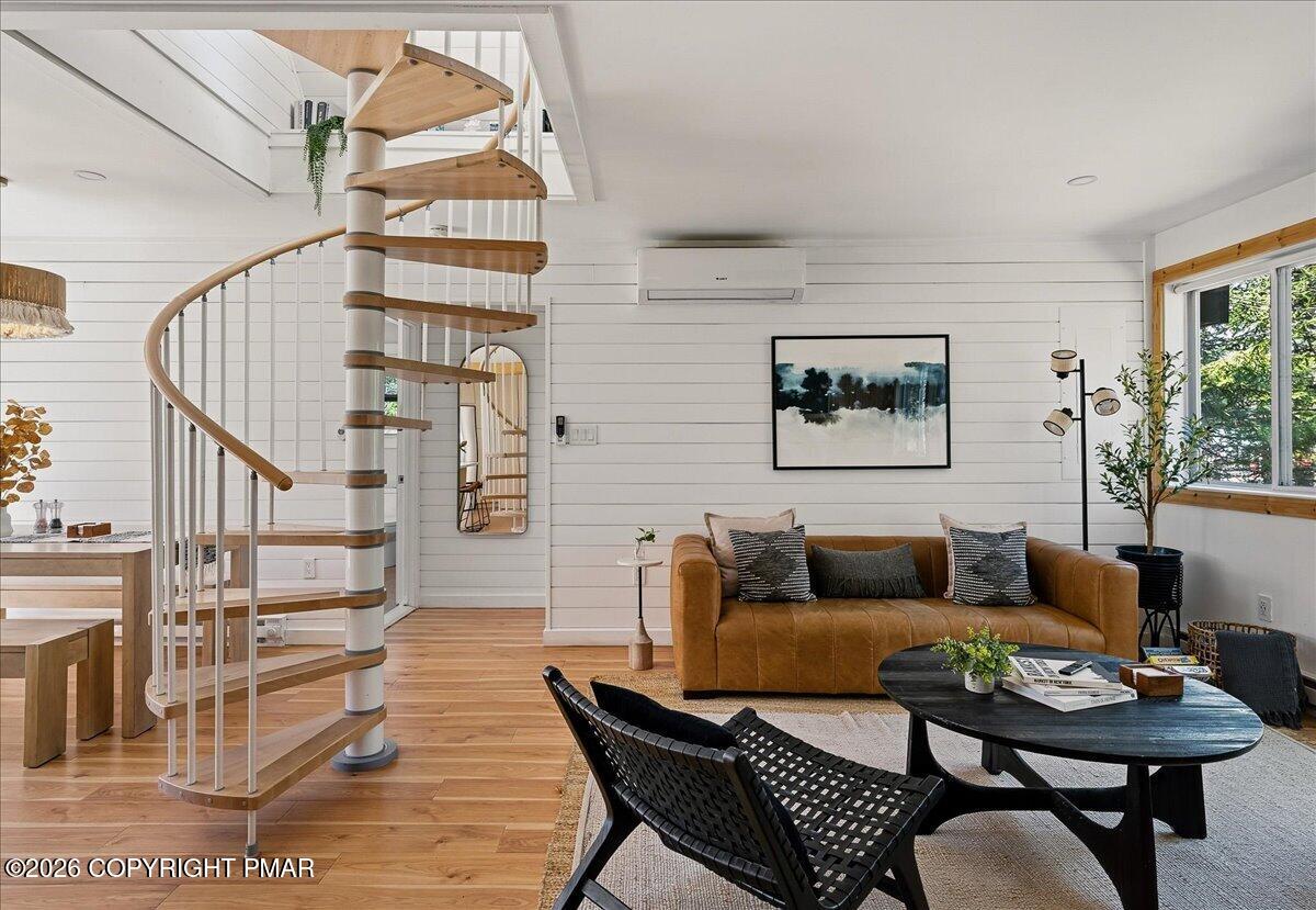 5306 Hummingbird Drive Pocono Summit, PA 18346 - Photo 4 of 32 a living room with furniture a rug and a window