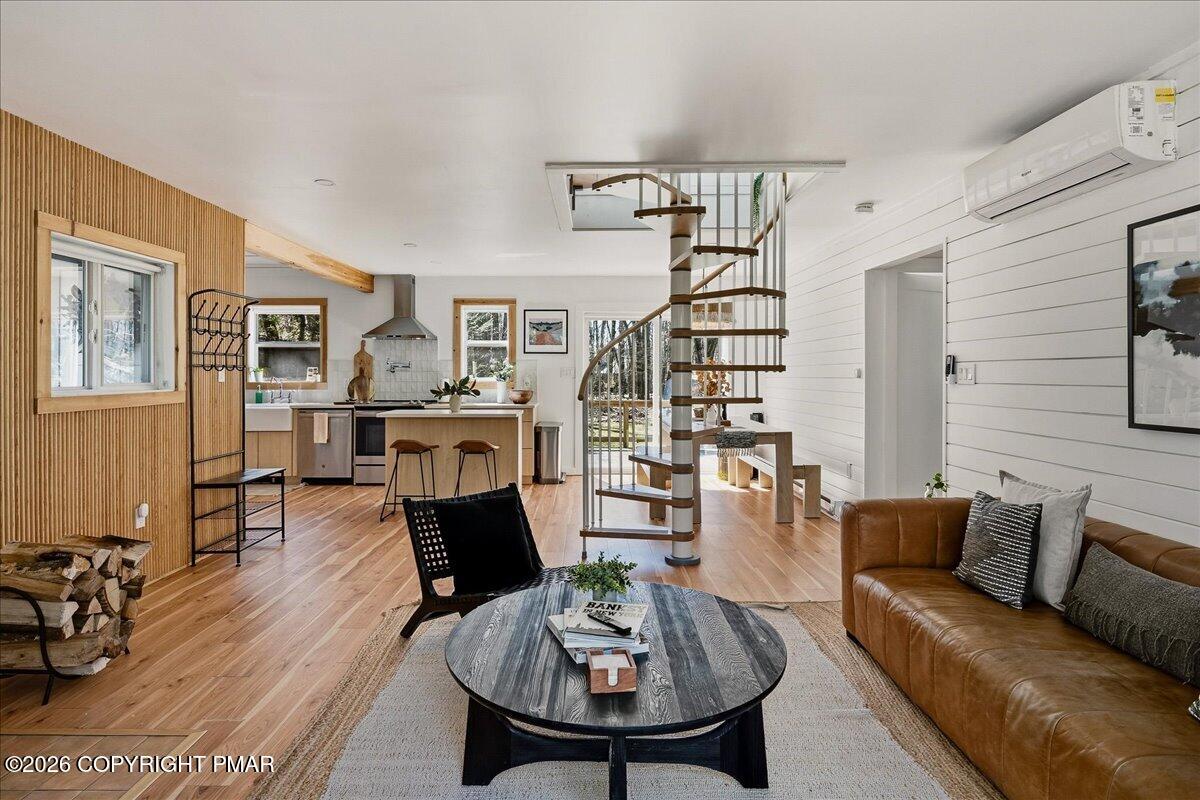 5306 Hummingbird Drive Pocono Summit, PA 18346 - Photo 5 of 32 a living room with furniture and wooden floor
