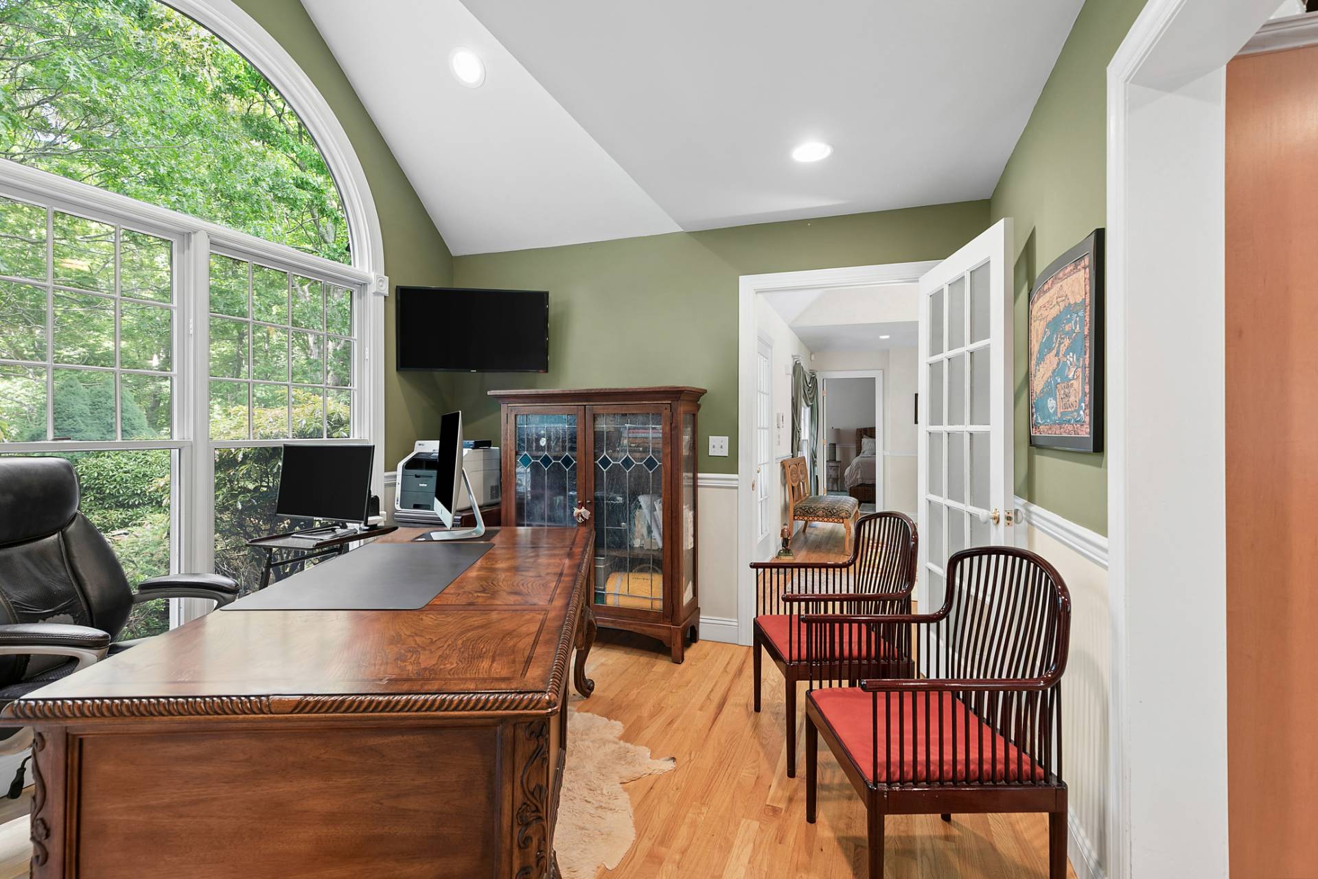 1557 Millstone Road Sag Harbor, NY 11963 - Photo 11 of 12 a living room with furniture and a fireplace