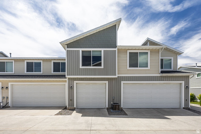 2483 South 1296th Street West Logan, UT 84321 - Photo 32 of 45 Modern multi-level townhome featuring a distinctive asymmetrical roofline and mixed siding