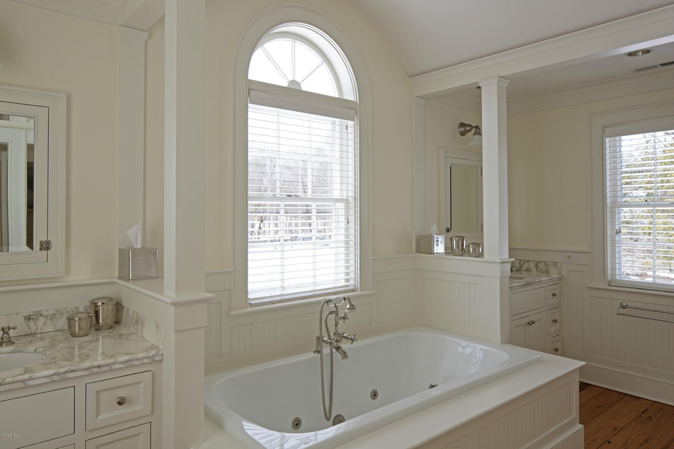 733 Lake Avenue Greenwich, CT 06830 - Photo 15 of 25 a bathroom with a granite countertop sink a window and a mirror