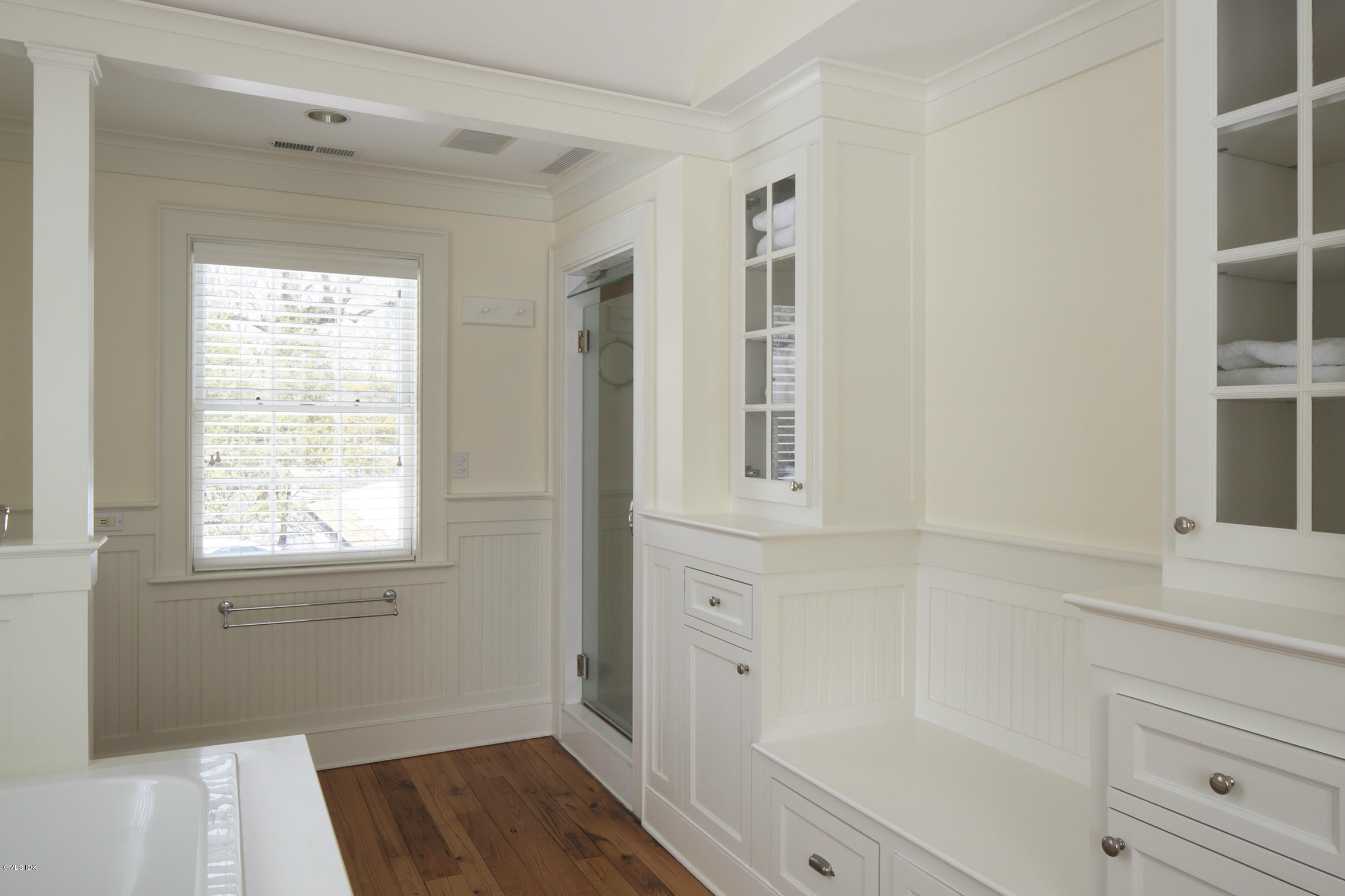 733 Lake Avenue Greenwich, CT 06830 - Photo 16 of 25 a bathroom with a window bathtub and shower