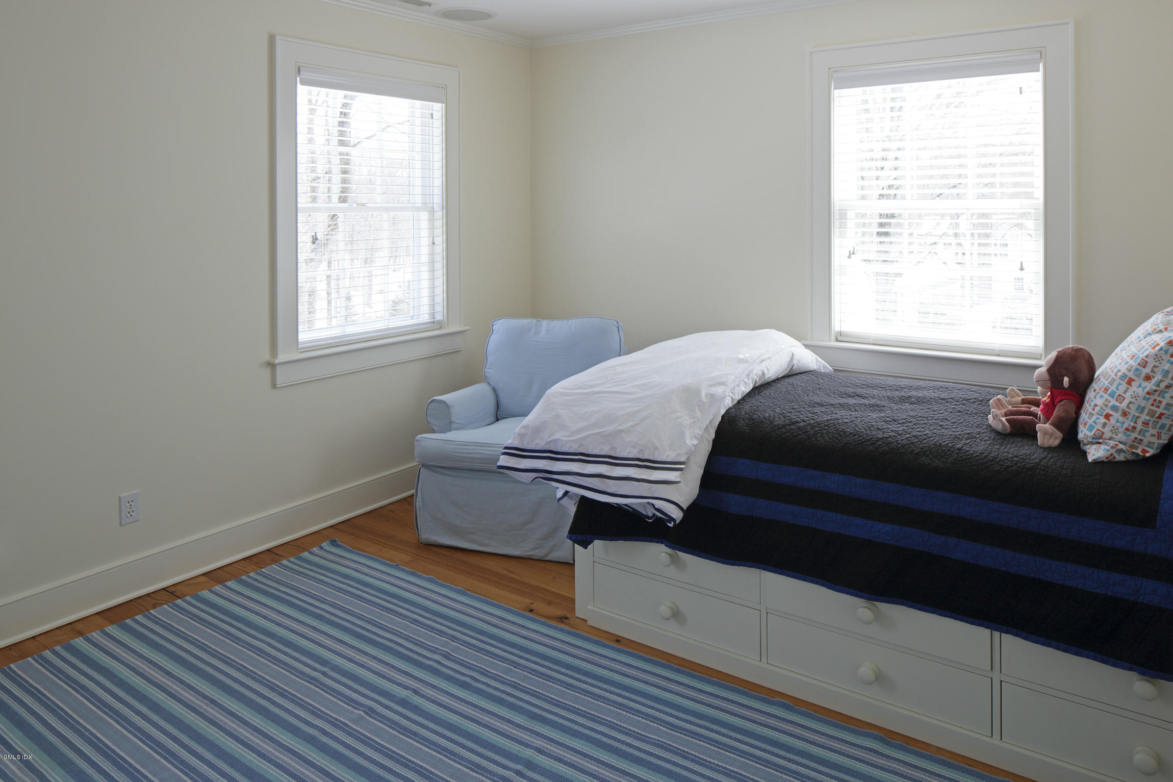 733 Lake Avenue Greenwich, CT 06830 - Photo 19 of 25 a bedroom with bed and window