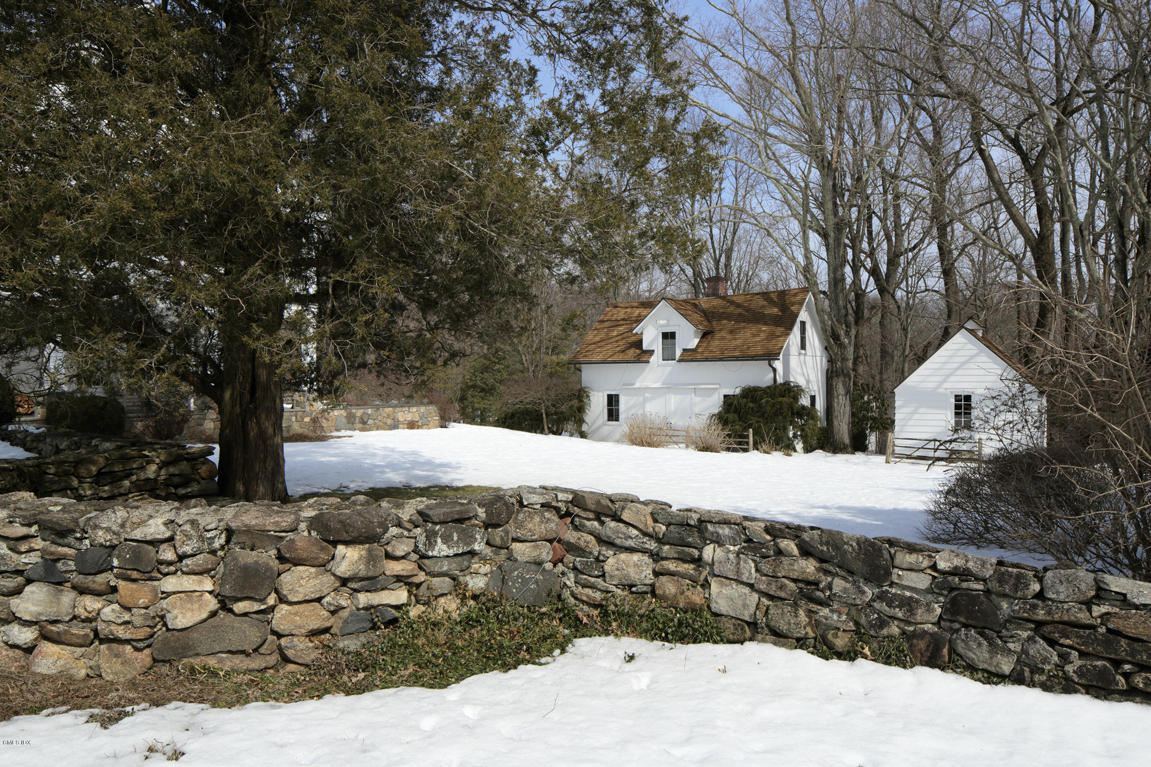 733 Lake Avenue Greenwich, CT 06830 - Photo 2 of 25 a street view with large trees