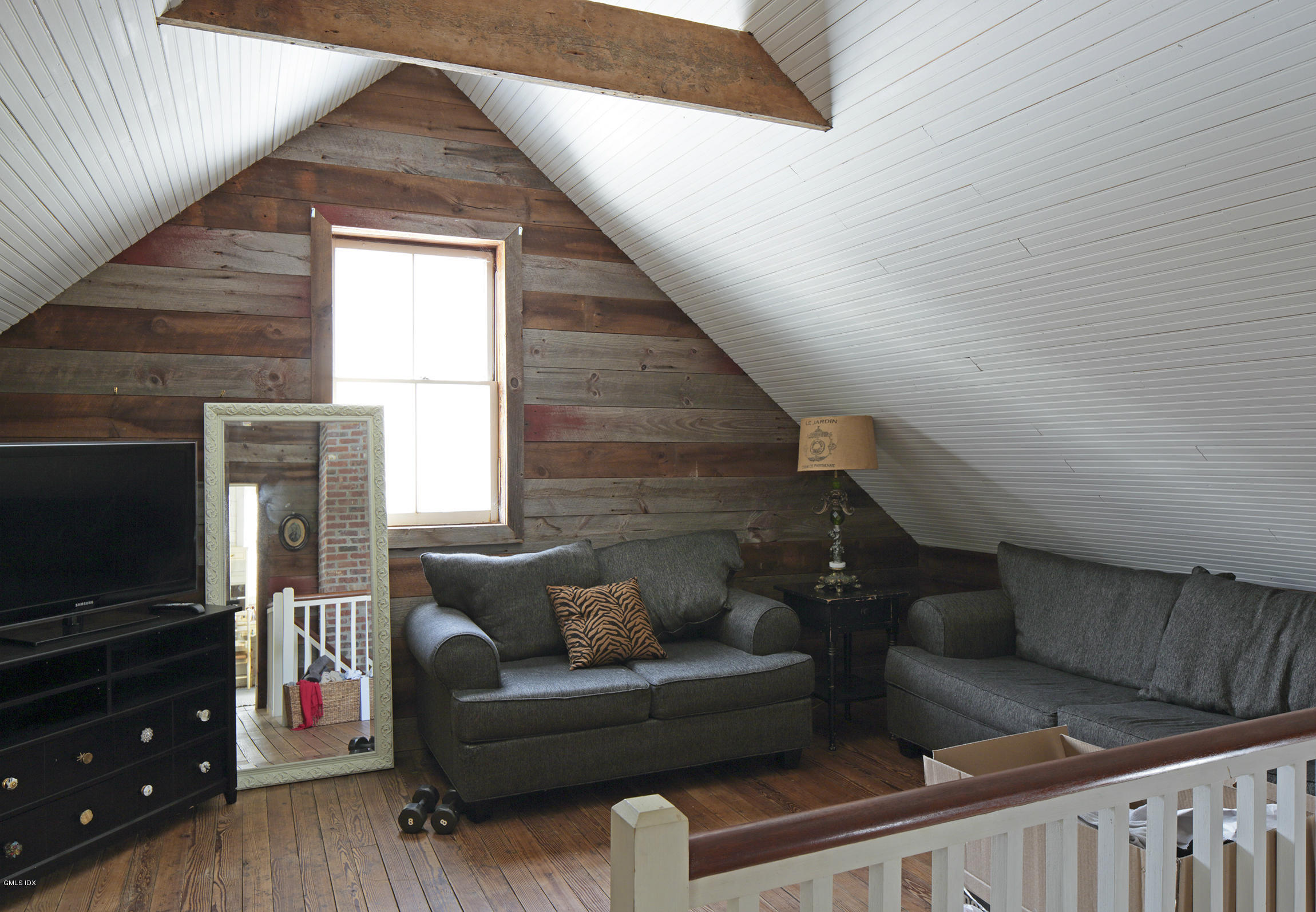 733 Lake Avenue Greenwich, CT 06830 - Photo 22 of 25 a living room with furniture and a flat screen tv