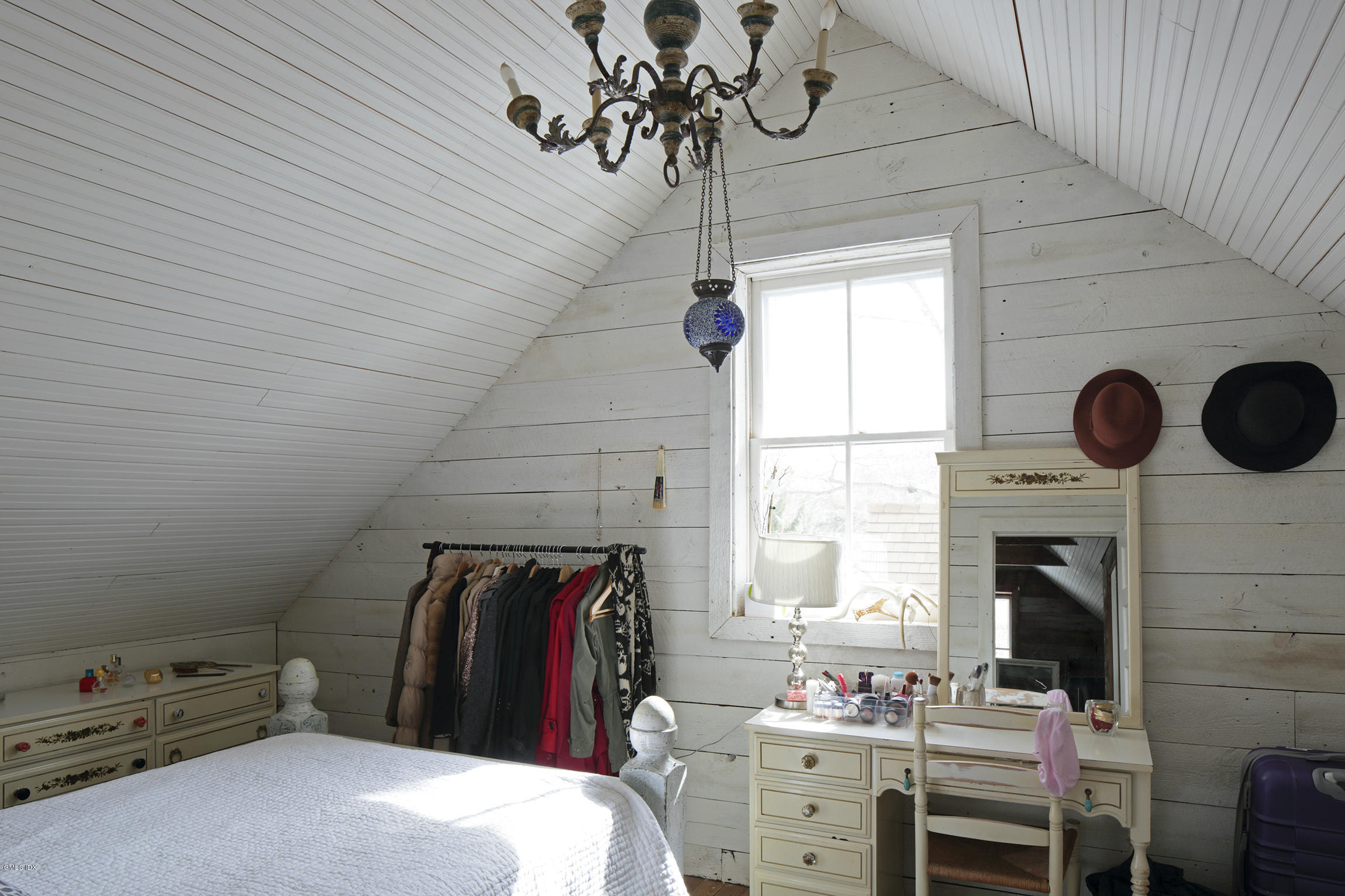 733 Lake Avenue Greenwich, CT 06830 - Photo 23 of 25 a bedroom with a bed and a fireplace