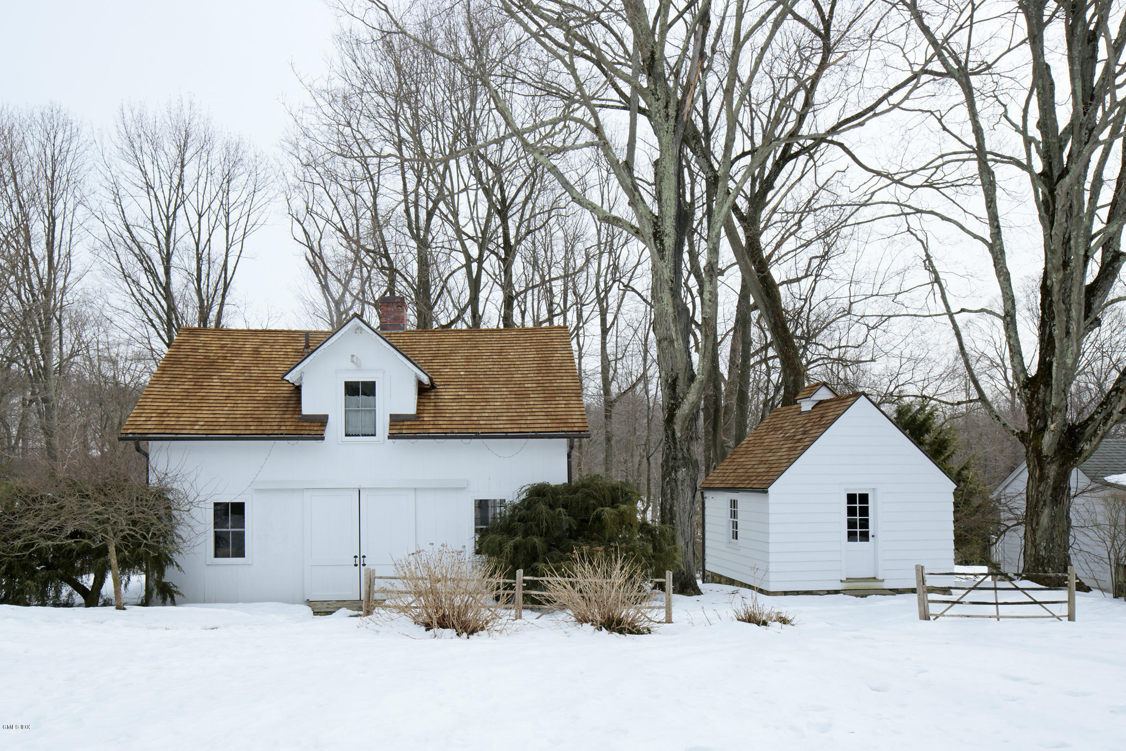 733 Lake Avenue Greenwich, CT 06830 - Photo 24 of 25 a view of a house with a yard covered in snow