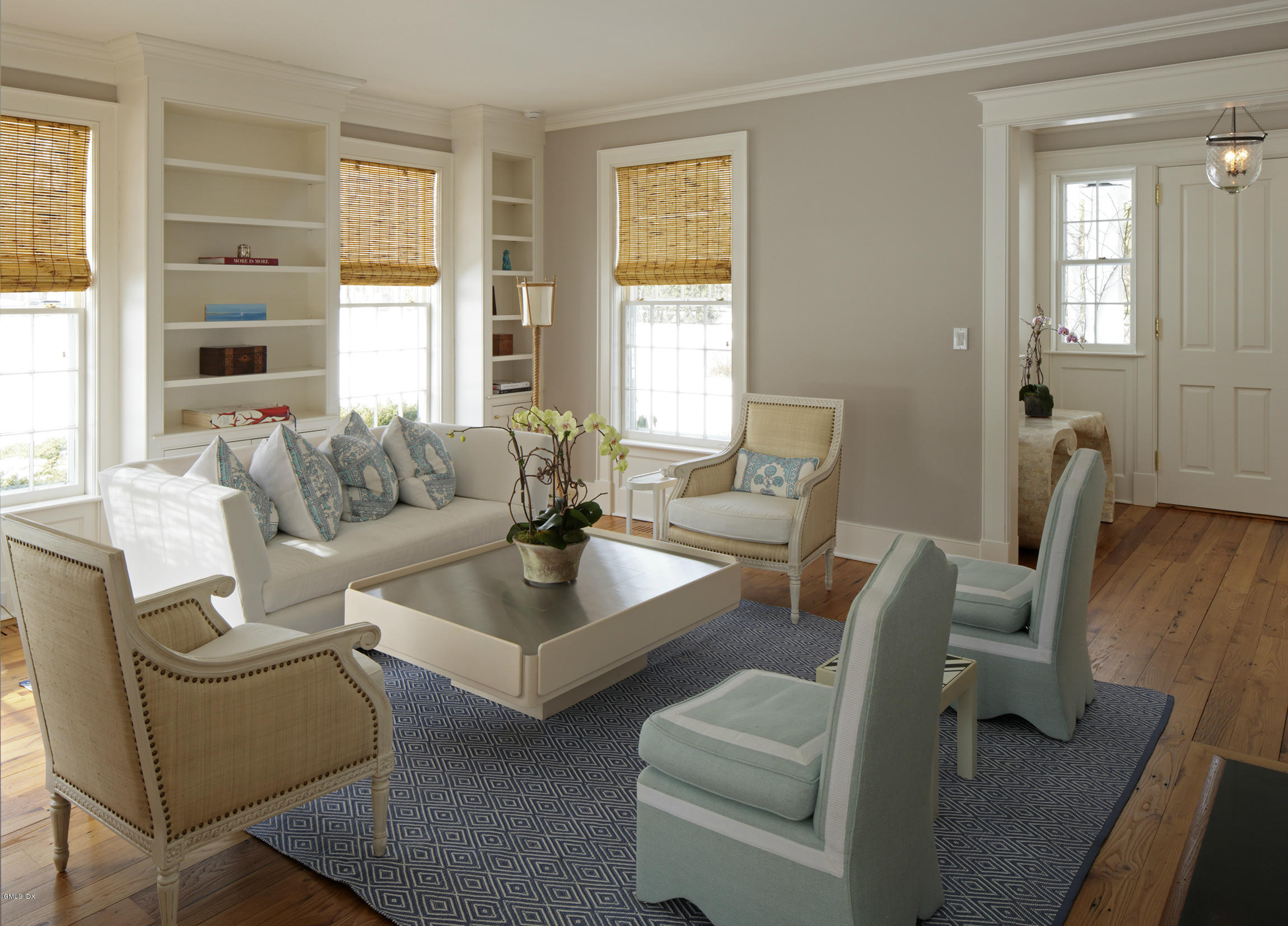 733 Lake Avenue Greenwich, CT 06830 - Photo 6 of 25 a living room with furniture and a large window