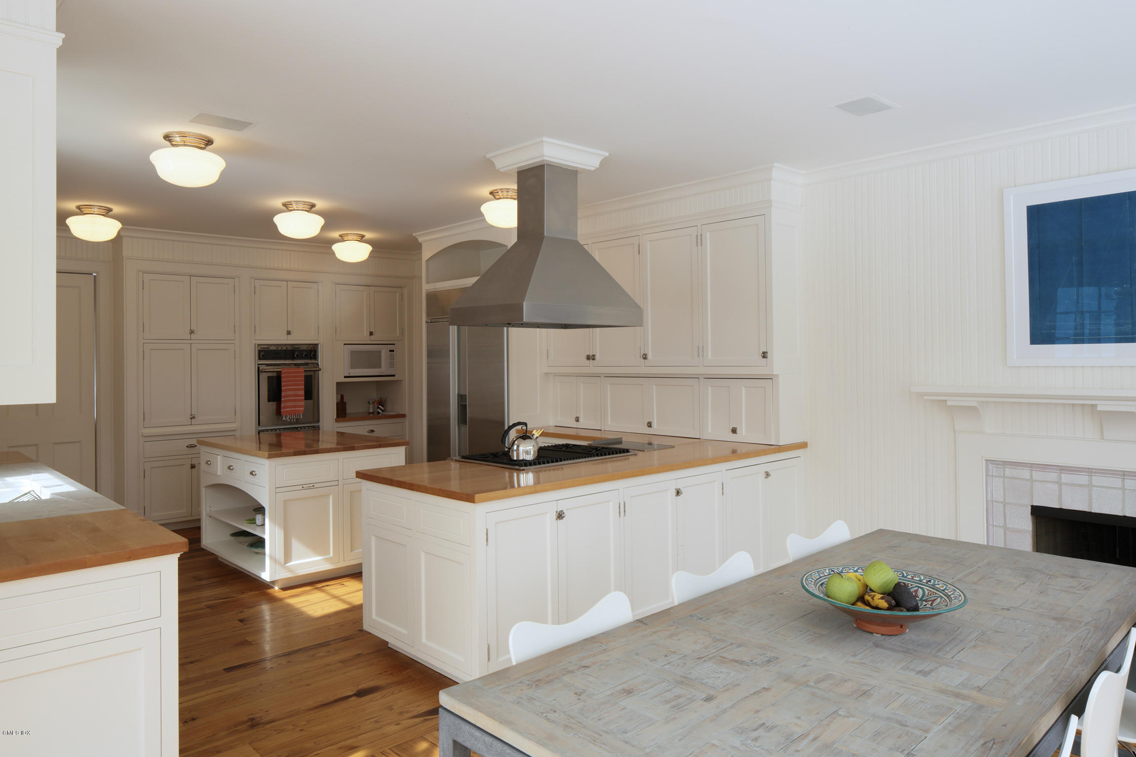 733 Lake Avenue Greenwich, CT 06830 - Photo 9 of 25 a kitchen with a sink cabinets and wooden floor