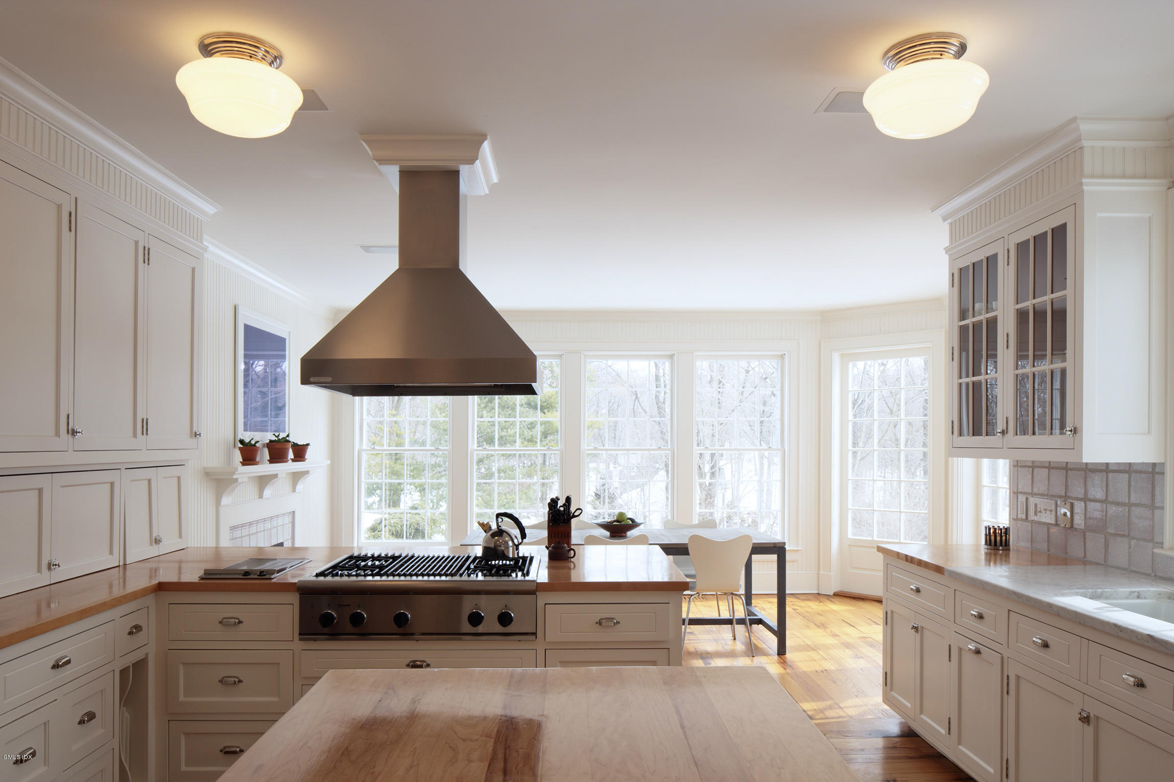 733 Lake Avenue Greenwich, CT 06830 - Photo 10 of 25 a living room with kitchen island furniture and a window