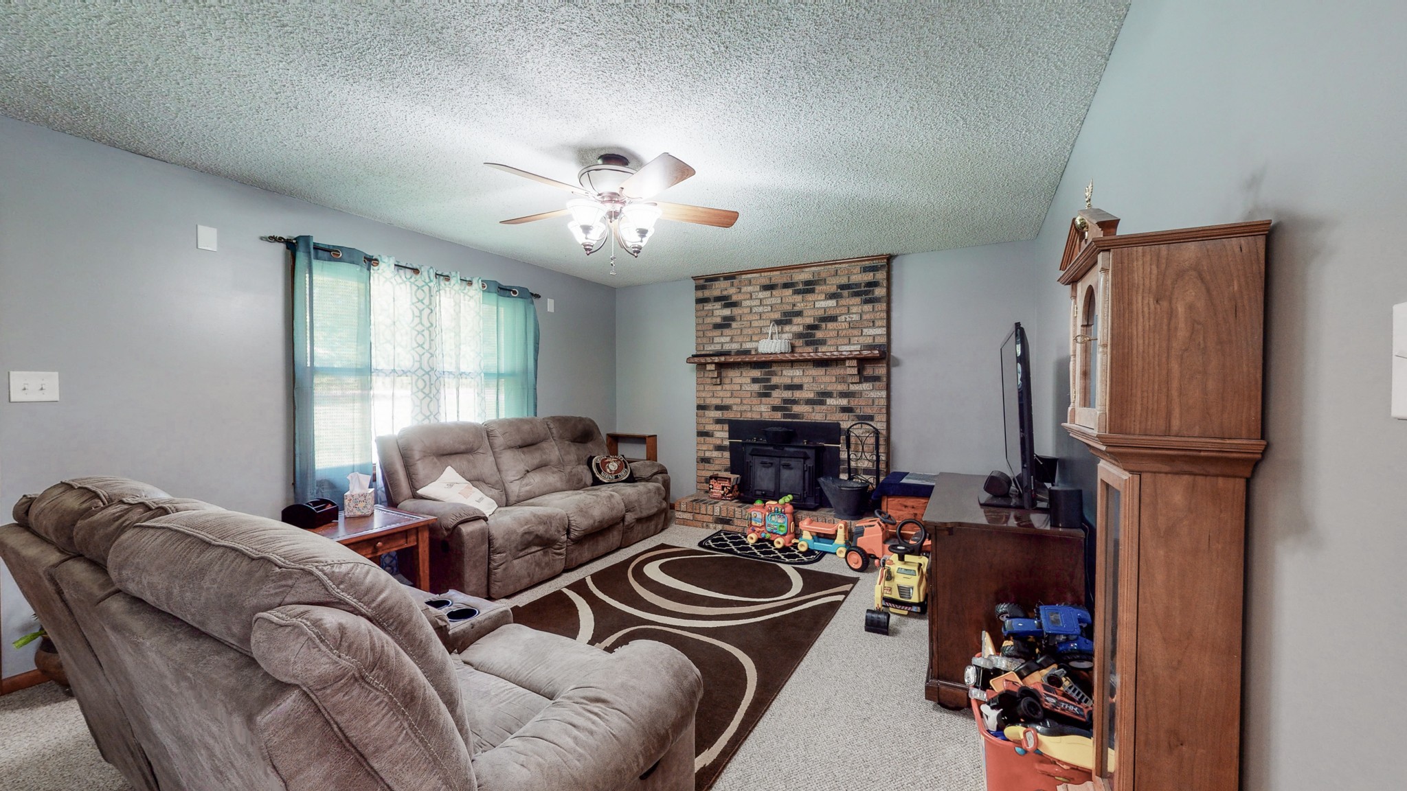 280 Lindsley Road Lebanon, TN 37090 - Photo 11 of 41 a living room with furniture a chandelier and a window
