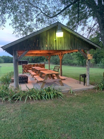 280 Lindsley Road Lebanon, TN 37090 - Photo 38 of 41 a backyard of a house with table and chairs