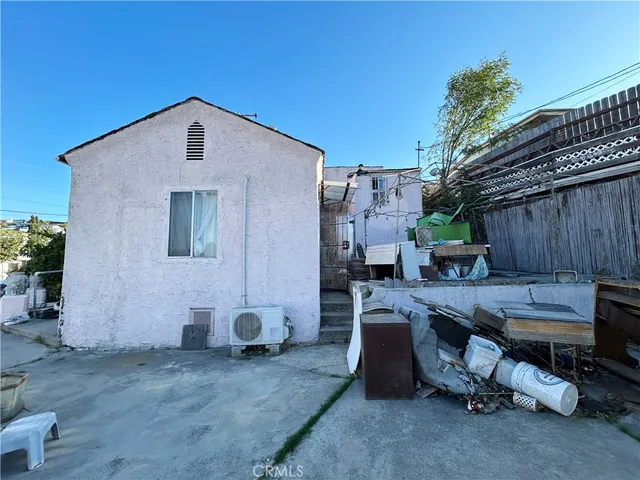 a view of a backyard with a sitting area