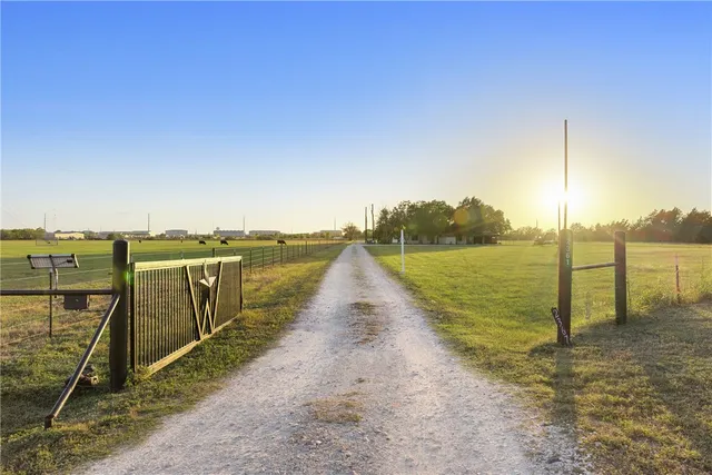 a view of a lake with a yard