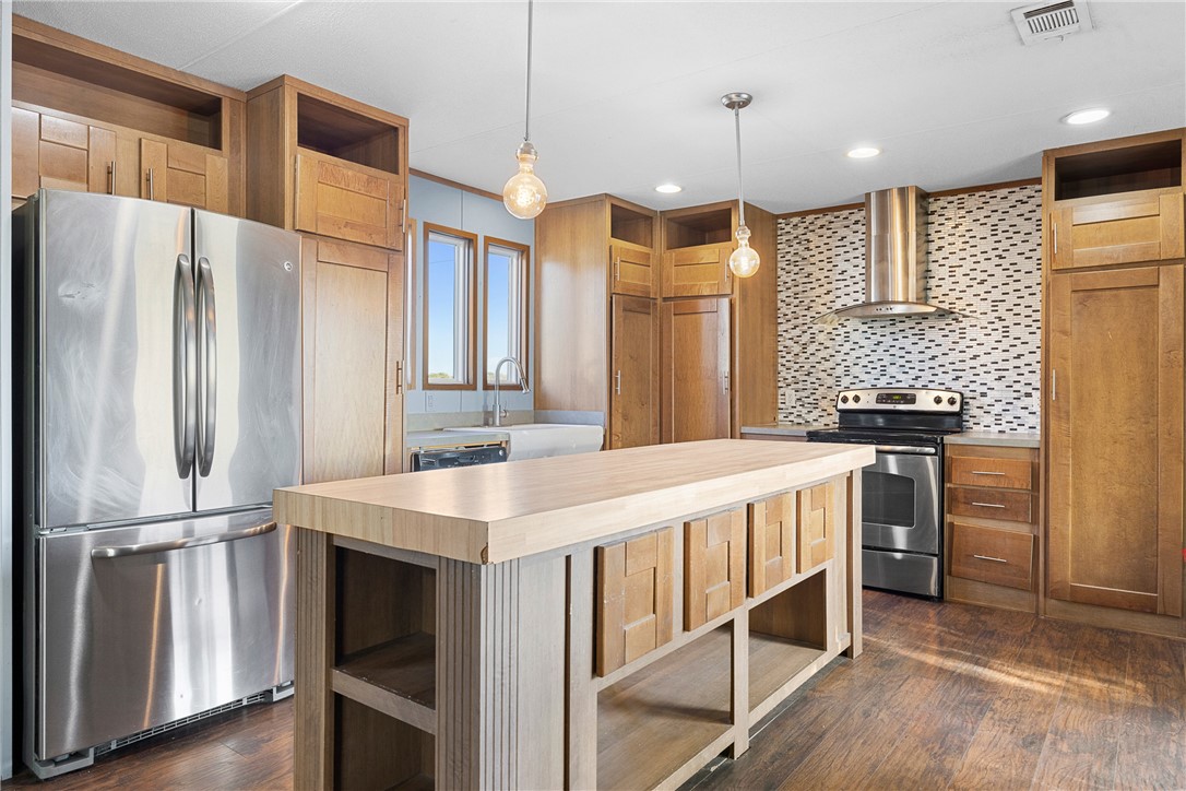 2361 Smetana Road Bryan, TX 77807 - Photo 2 of 32 a kitchen with kitchen island a counter top space stainless steel appliances and cabinets