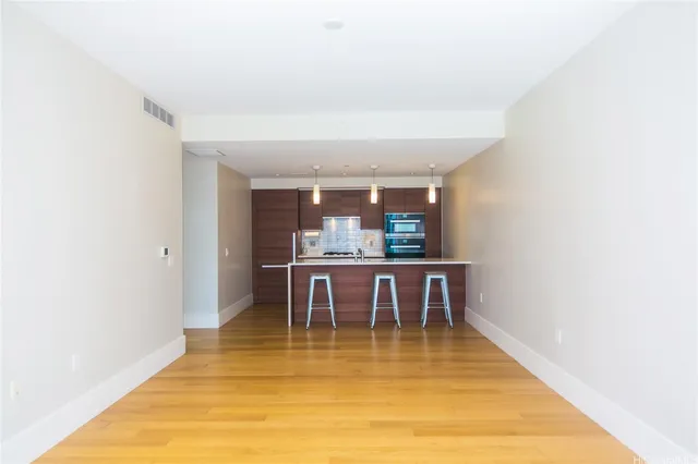 a view of a dining room with furniture and a rug
