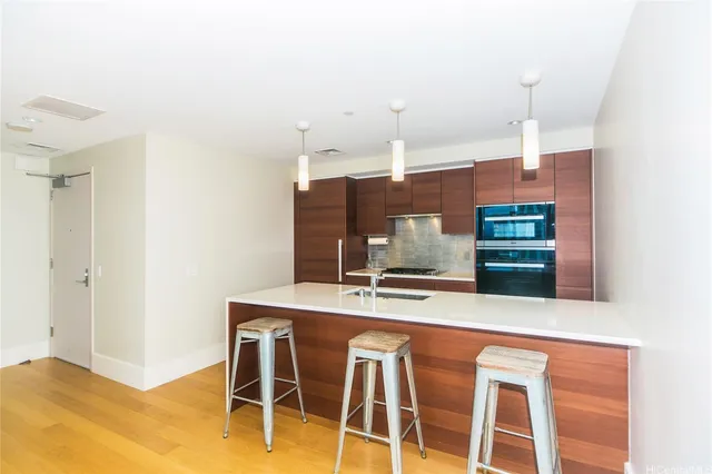 a kitchen with a table and chairs