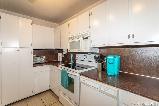 3093 Point Clear Drive Tega Cay, SC 29708 - Photo 15 of 28 a kitchen with a sink a stove and cabinets