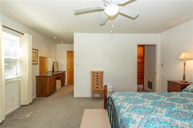 3093 Point Clear Drive Tega Cay, SC 29708 - Photo 20 of 28 a bedroom with a bed and a chandelier
