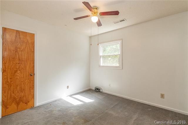 3093 Point Clear Drive Tega Cay, SC 29708 - Photo 24 of 28 an empty room with a window and a fan