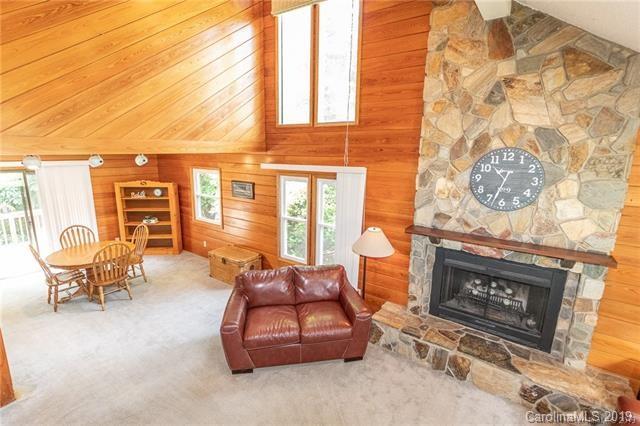 3093 Point Clear Drive Tega Cay, SC 29708 - Photo 8 of 28 a living room with furniture a window and a fireplace