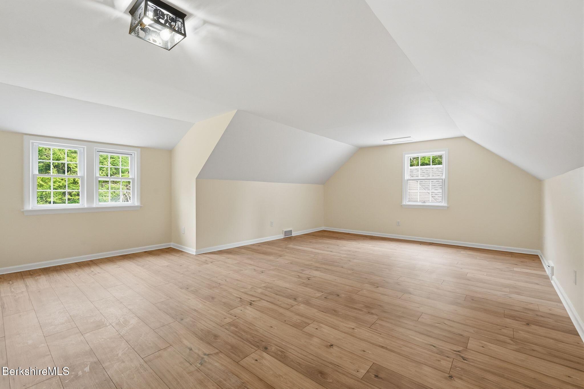 98 N Road Monroe, MA 01247 - Photo 24 of 32 a view of an empty room with a window and wooden floor
