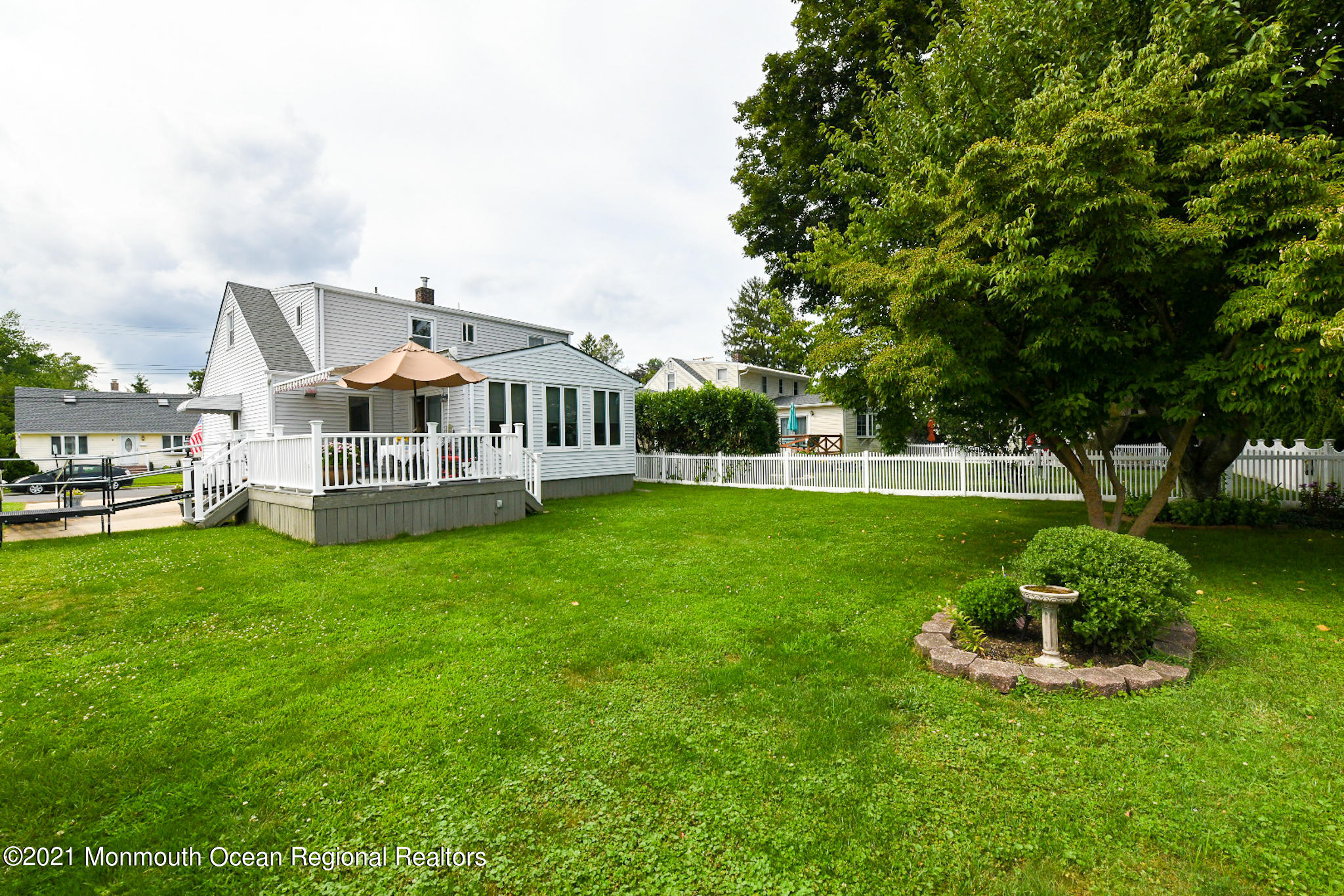 a front view of a house with a yard table and chairs