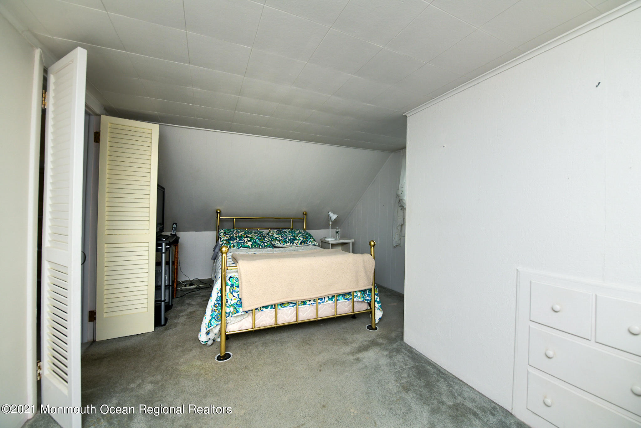 5 Phyllis Road West Orange, NJ 07052 - Photo 14 of 18 a room with a bed and a night stand