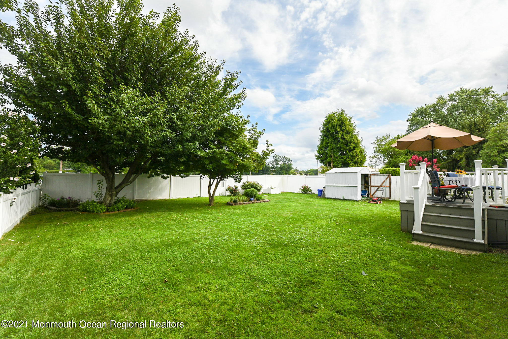 5 Phyllis Road West Orange, NJ 07052 - Photo 18 of 18 a view of a bench in the garden near a tree