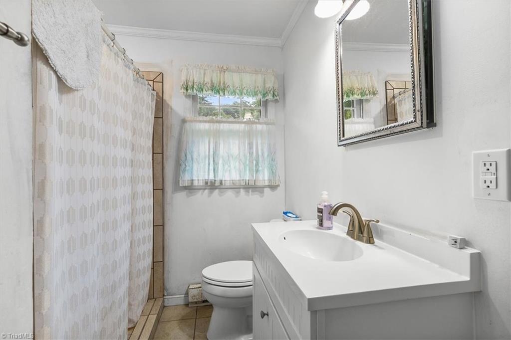 5822 Ruralview Road Gibsonville, NC 27249 - Photo 22 of 35 Rear bath, updated in 2016 with a walk-in tiled shower