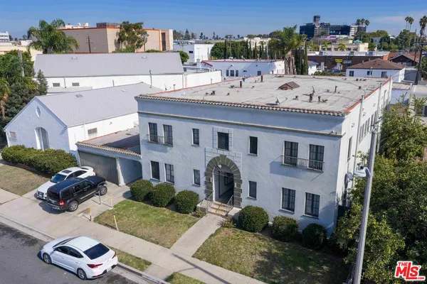 a aerial view of a house with a yard