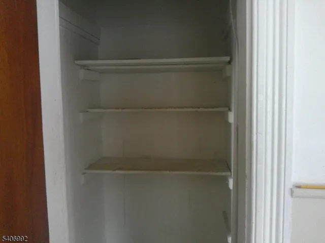 a kitchen with a stove and a refrigerator