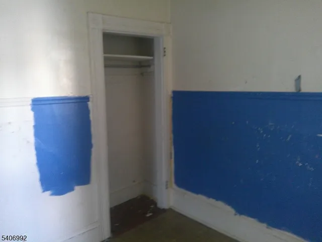 a white toilet sitting next to a bath tub