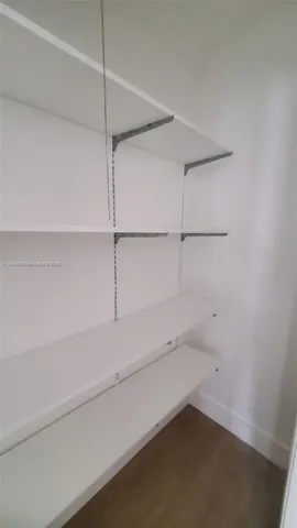 a view of an empty walk in closet