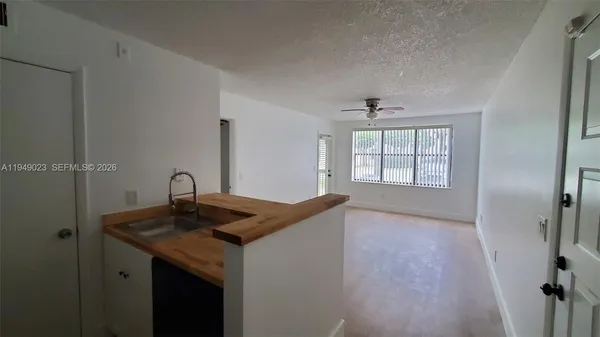 a kitchen with sink and window