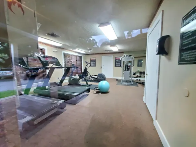 a view of a room with gym equipment