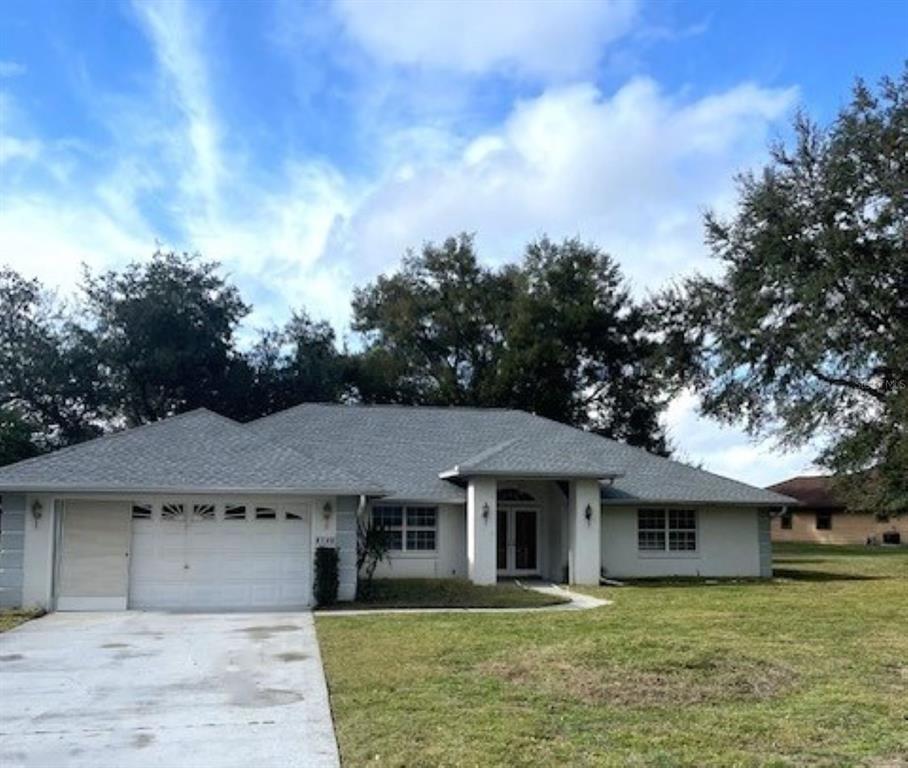 8148 Southwest 54th Court Ocala, FL 34476 - Photo 1 of 1 a front view of a house with garden