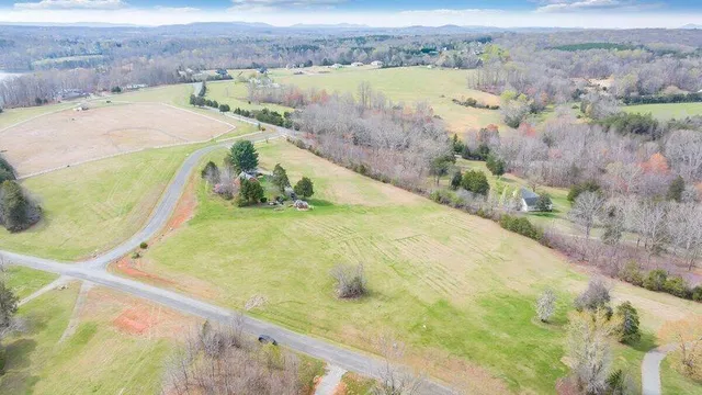a view of a swimming pool with a yard